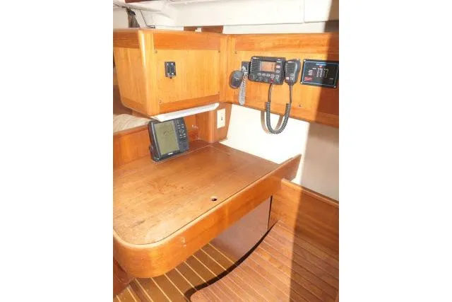 Slide: The Image of Navigation station in 1999 Hunter 450 Passage sailboat with communication equipment. - 22