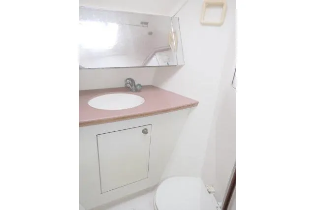 Slide: The Image of Bathroom interior of 1999 Hunter 450 Passage yacht with sink and mirror. - 33