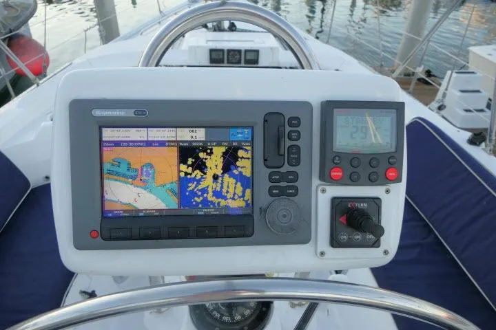 Slide: The Image of Navigation system on a 1999 Hunter 450 Passage sailboat, featuring a detailed marine display. - 53
