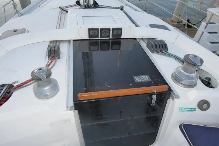 Slide: The Image of Cockpit of 1999 Hunter 450 Passage sailboat with winches and control panel. - 54