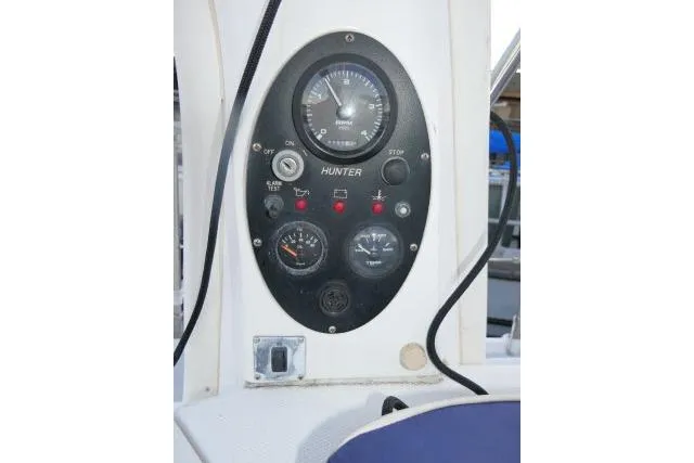 Slide: The Image of Control panel of a 1999 Hunter 450 Passage sailboat with gauges and switches. - 56