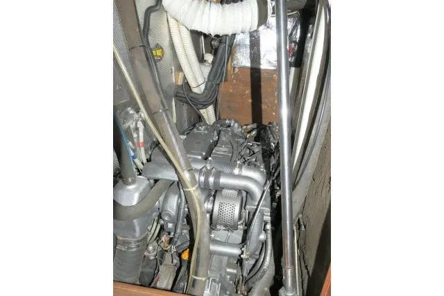 Slide: The Image of Engine compartment of 1999 Hunter 450 Passage sailboat, showcasing mechanical components. - 65