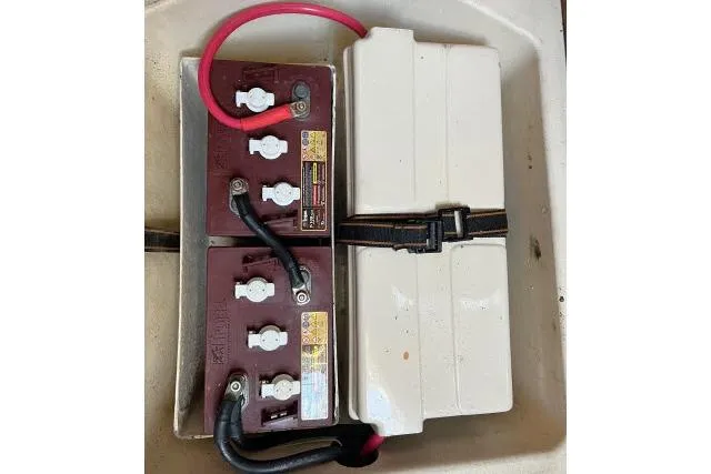 Slide: The Image of Battery compartment of a 1999 Hunter 450 Passage sailboat with secured cables. - 70