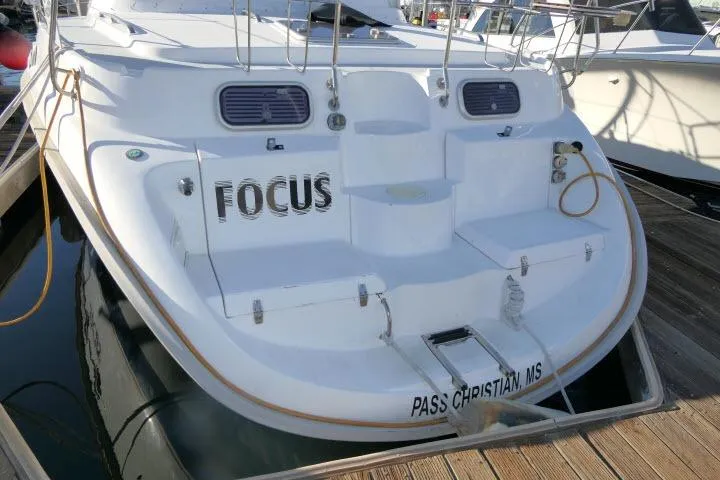Slide: The Image of Hunter 450 Passage 1999 sailboat docked, named "Focus," in Pass Christian, MS marina. - 74