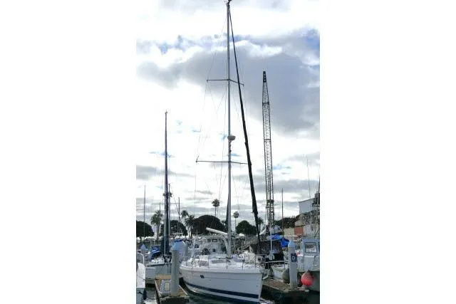 Slide: The Image of Sailboat in marina, 1999 Hunter 450 Passage, cloudy sky, surrounded by other boats. - 75
