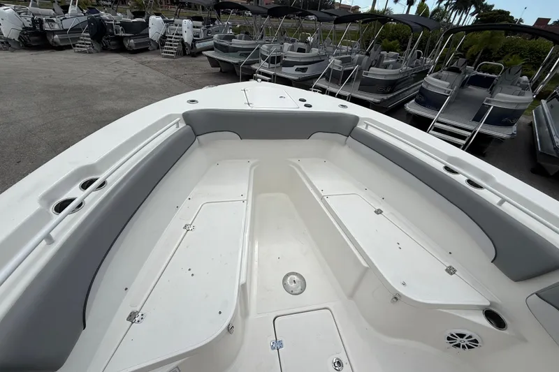 Slide: The Image of 2021 NauticStar 28 XS Offshore boat interior with seating and storage compartments. - 18