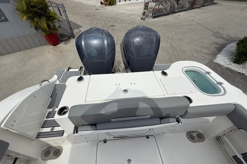 Slide: The Image of 2021 NauticStar 28 XS Offshore boat with dual engines and seating area. - 22