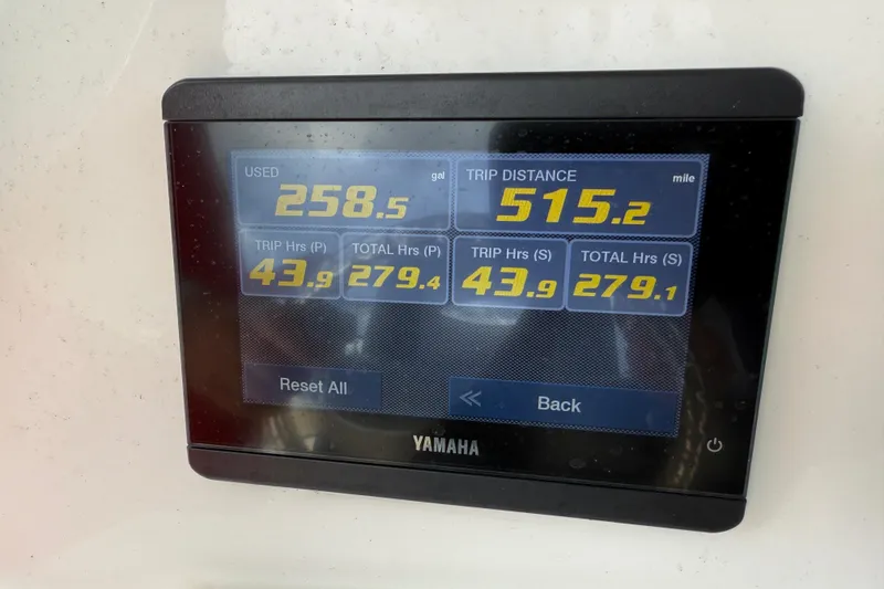 Slide: The Image of Yamaha display showing fuel usage and trip data on 2021 NauticStar 28 XS Offshore. - 25