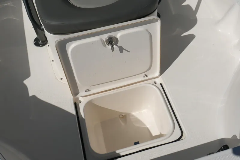 Slide: The Image of 2023 Sea Born FX24 Bay boat storage compartment with open lid. - 12
