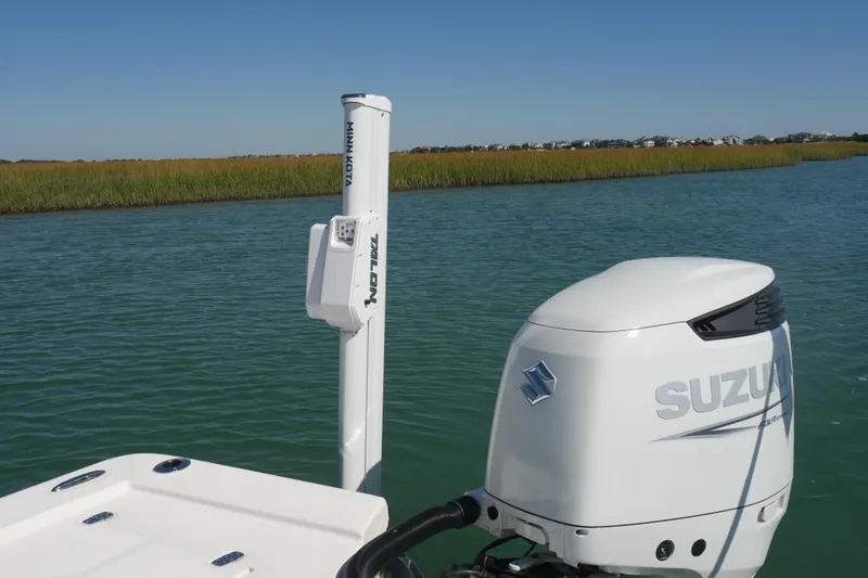 Slide: The Image of 2023 Sea Born FX24 Bay boat with Suzuki engine on calm water. - 22