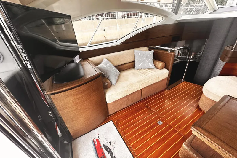 Slide: The Image of Luxurious interior of 2007 Azimut 43S yacht with wooden flooring and modern furnishings. - 10