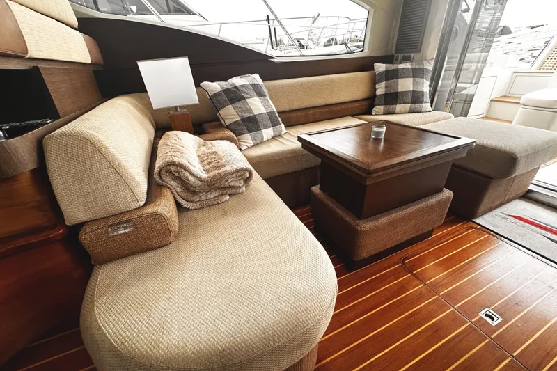 Slide: The Image of Luxurious interior of 2007 Azimut 43S yacht with elegant seating and wooden flooring. - 12
