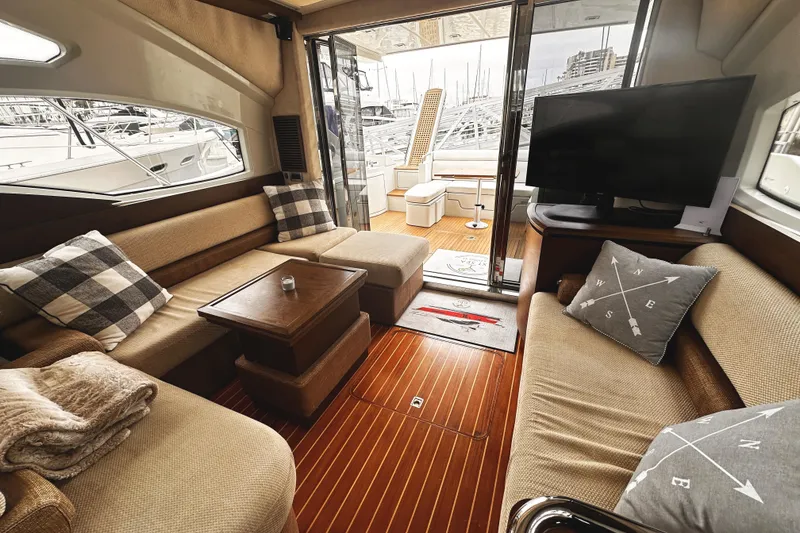 Slide: The Image of Luxurious interior of a 2007 Azimut 43S yacht with cozy seating and modern decor. - 14