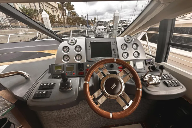 Slide: The Image of Cockpit of 2007 Azimut 43S yacht with steering wheel and control panel. - 16