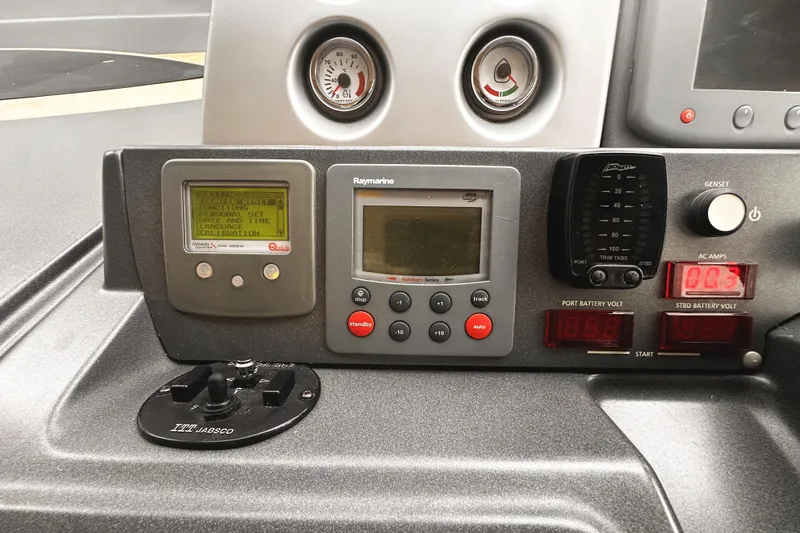 Slide: The Image of Control panel of a 2007 Azimut 43S yacht with navigation and battery displays. - 17