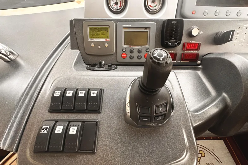 Slide: The Image of Control panel of a 2007 Azimut 43S yacht with joystick and digital displays. - 18