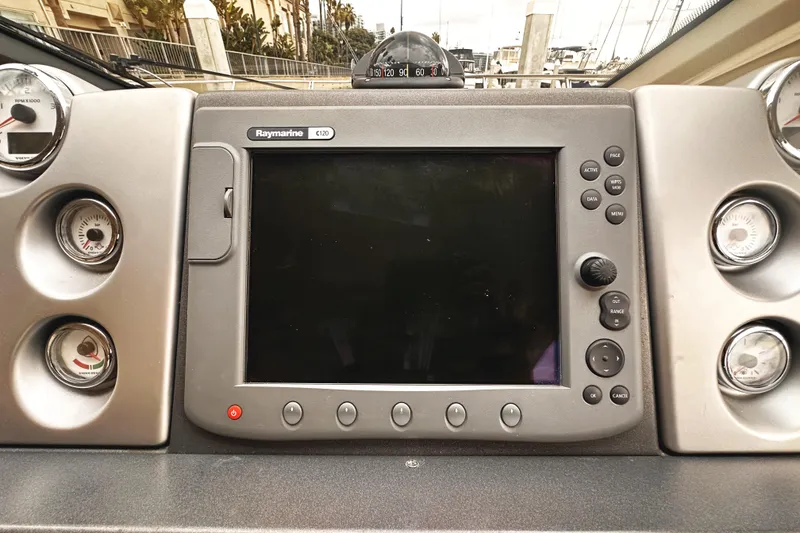 Slide: The Image of Dashboard of a 2007 Azimut 43S yacht featuring a Raymarine C120 display. - 19