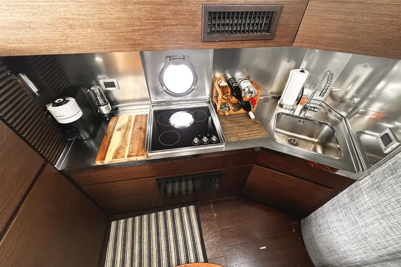 Slide: The Image of Luxurious 2007 Azimut 43S yacht kitchen with modern appliances and sleek design. - 23