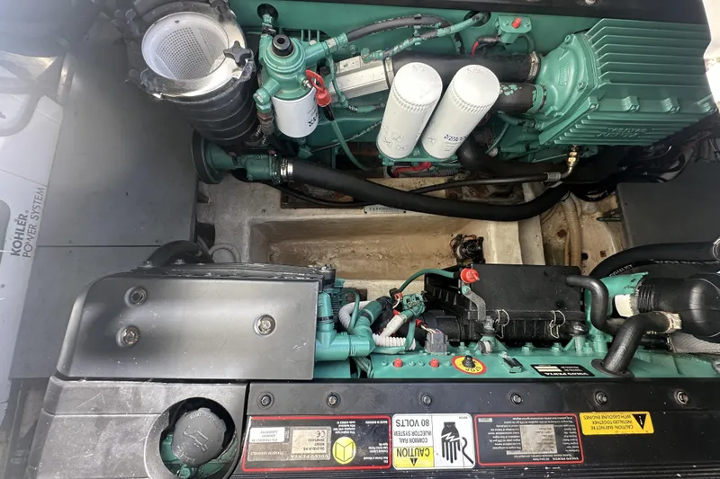 Slide: The Image of Engine compartment of a 2007 Azimut 43S yacht, showcasing mechanical components and systems. - 37