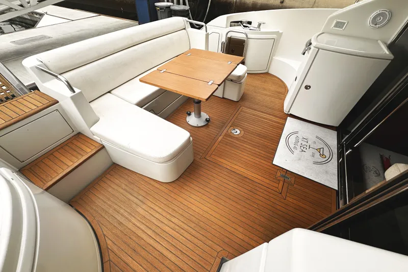 Slide: The Image of Luxurious 2007 Azimut 43S yacht deck with white seating and wooden table. - 5