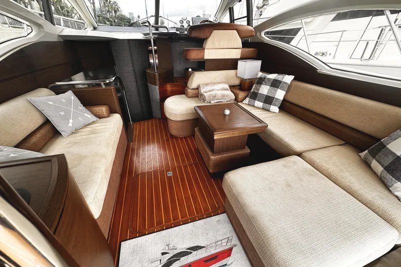 Slide: The Image of Luxurious interior of a 2007 Azimut 43S yacht with elegant seating and wooden flooring. - 8