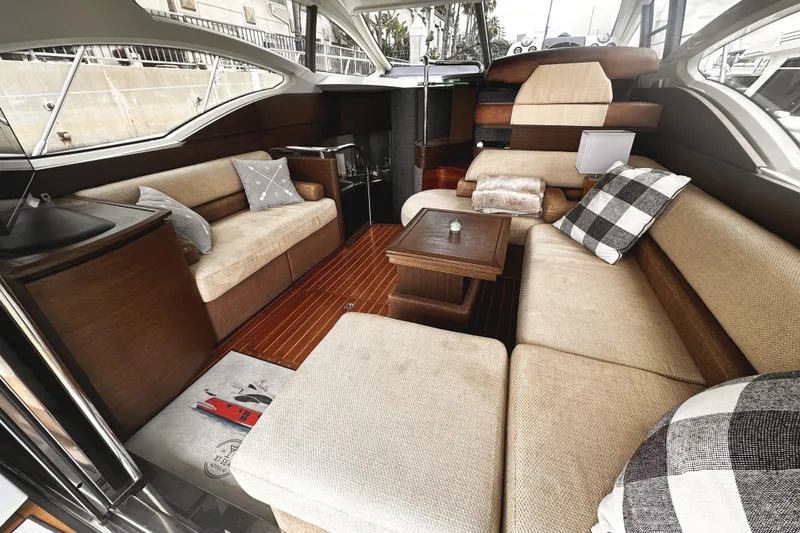 Slide: The Image of Luxurious interior of a 2007 Azimut 43S yacht with elegant seating and wooden accents. - 9