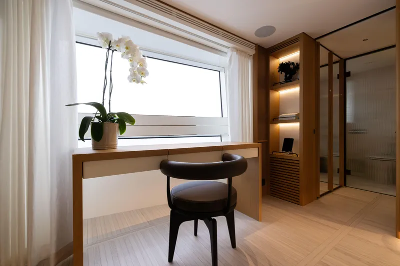 Slide: The Image of Luxurious interior of 2025 Benetti Oasis 34M yacht with elegant desk and orchid. - 30