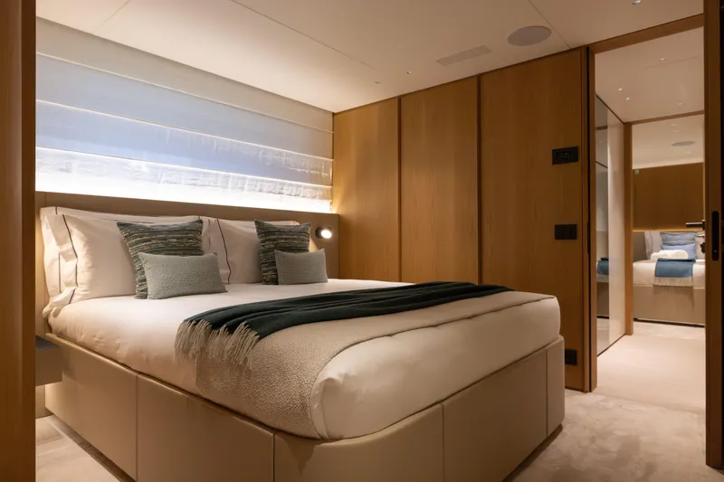 Slide: The Image of Luxurious bedroom interior of 2025 Benetti Oasis 34M yacht, featuring elegant design and cozy ambiance. - 45