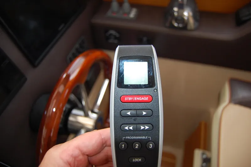 Slide: The Image of Remote control for 2018 Ranger Tugs R29 boat, near wooden steering wheel. - 20