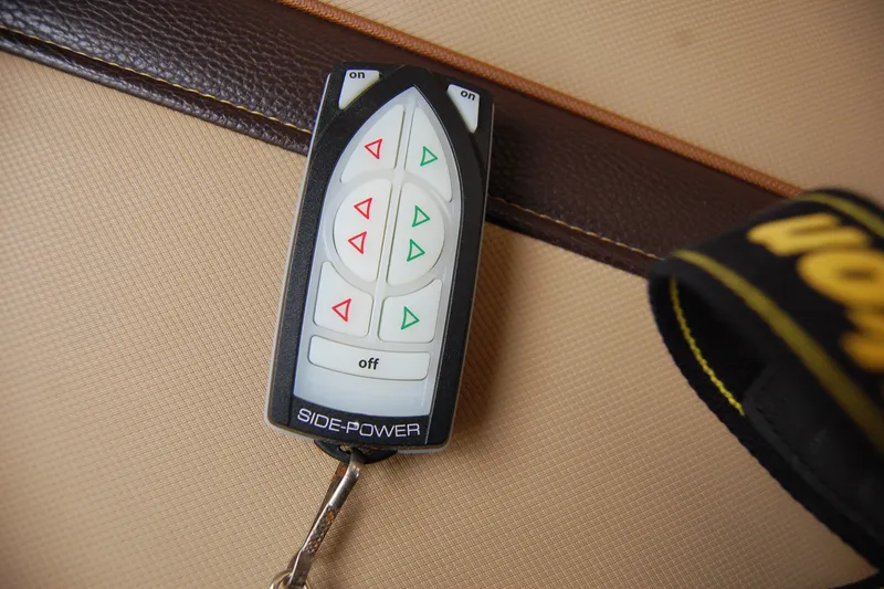Slide: The Image of Remote control for 2018 Ranger Tugs R29, featuring Side-Power thruster controls. - 22
