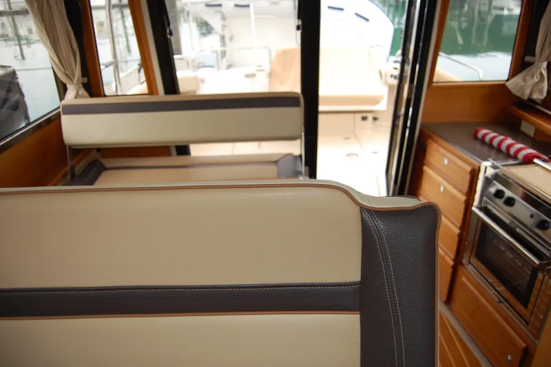 Slide: The Image of Interior of 2018 Ranger Tugs R29 boat with seating and kitchen area. - 28