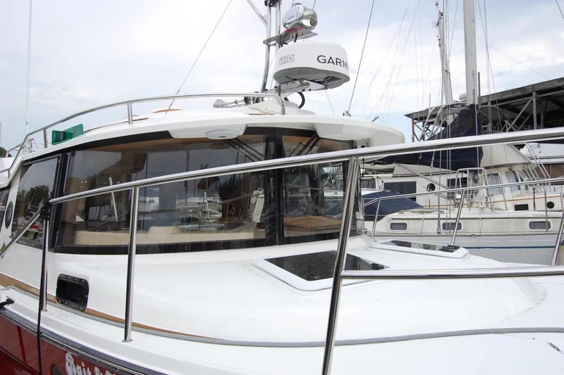 Slide: The Image of 2018 Ranger Tugs R29 boat docked, featuring sleek design and modern navigation equipment. - 4