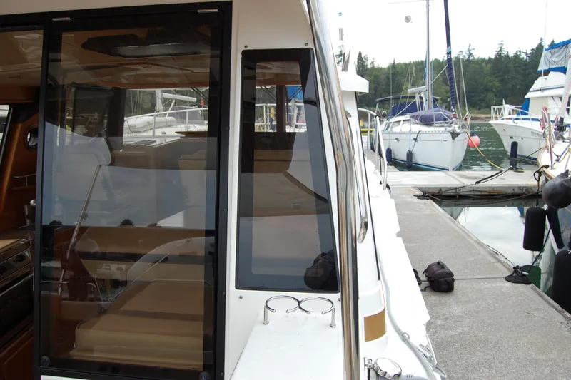 Slide: The Image of 2018 Ranger Tugs R29 docked, showcasing interior and exterior design features. - 41