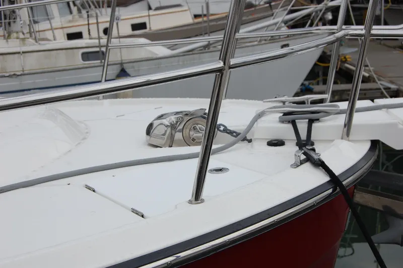 Slide: The Image of 2018 Ranger Tugs R29 boat deck with railing and anchor chain at marina. - 5