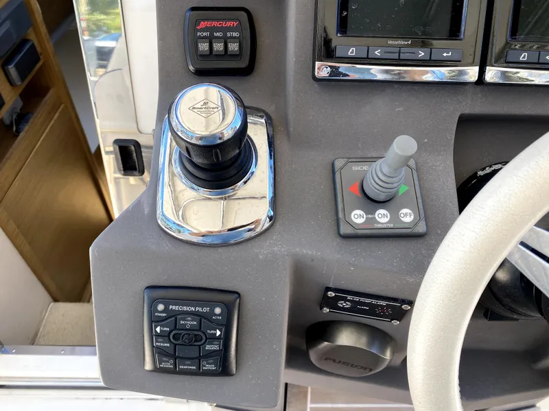 Slide: The Image of Close-up of 2014 Azimut Atlantis Verve Outboard control panel with joystick and buttons. - 31