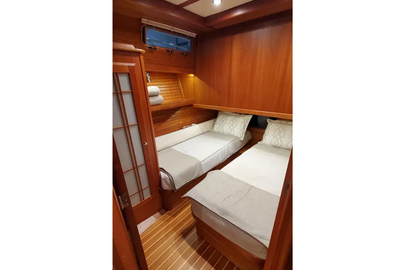 Slide: The Image of Luxurious bathroom in 2021 Sabre 45 Salon Express yacht with modern fixtures and wood cabinetry. - 13