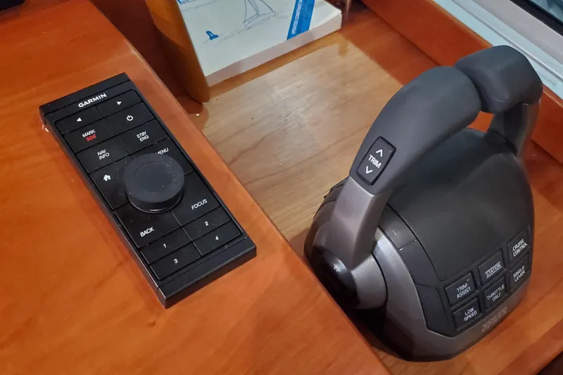 Slide: The Image of Control panels and marine radio equipment on a 2021 Sabre 45 Salon Express yacht. - 18