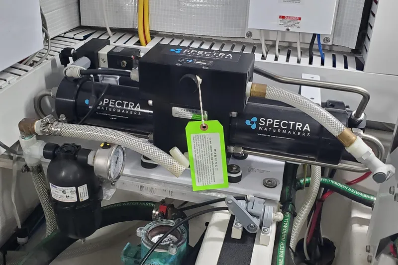 Slide: The Image of Laundry appliances inside 2021 Sabre 45 Salon Express yacht, featuring modern washer and dryer. - 29