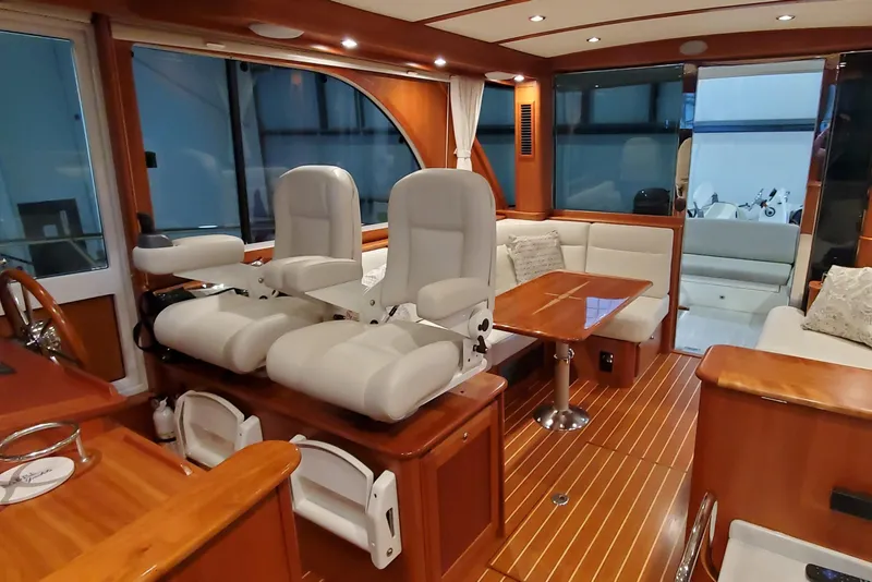 Slide: The Image of Interior of 2021 Sabre 45 Salon Express yacht with elegant wood finish and plush seating. - 3