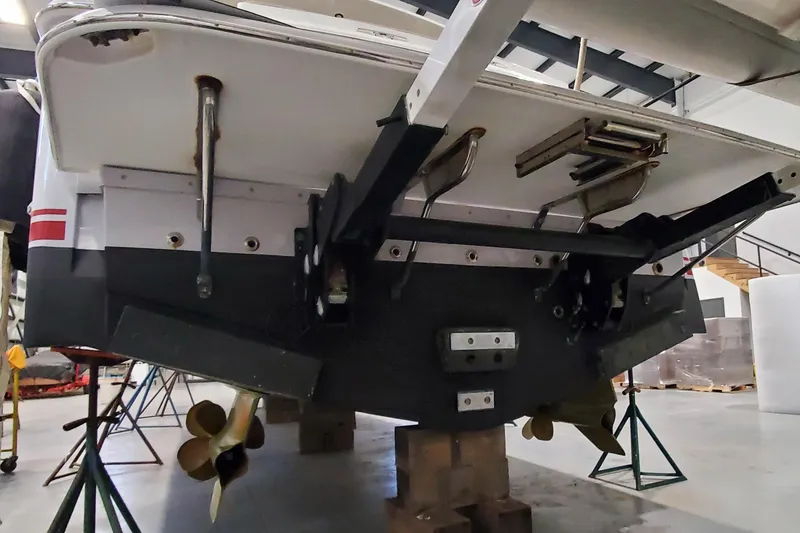 Slide: The Image of Engine room of 2021 Sabre 45 Salon Express with visible machinery and ladder. - 34