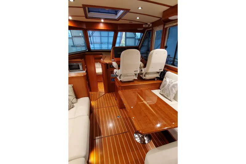 Slide: The Image of Luxurious interior of 2021 Sabre 45 Salon Express yacht with plush seating and elegant wood finishes. - 4