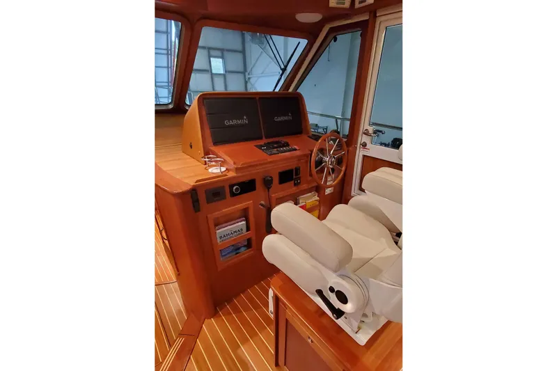 Slide: The Image of Interior of 2021 Sabre 45 Salon Express yacht with elegant wood finish and seating. - 5
