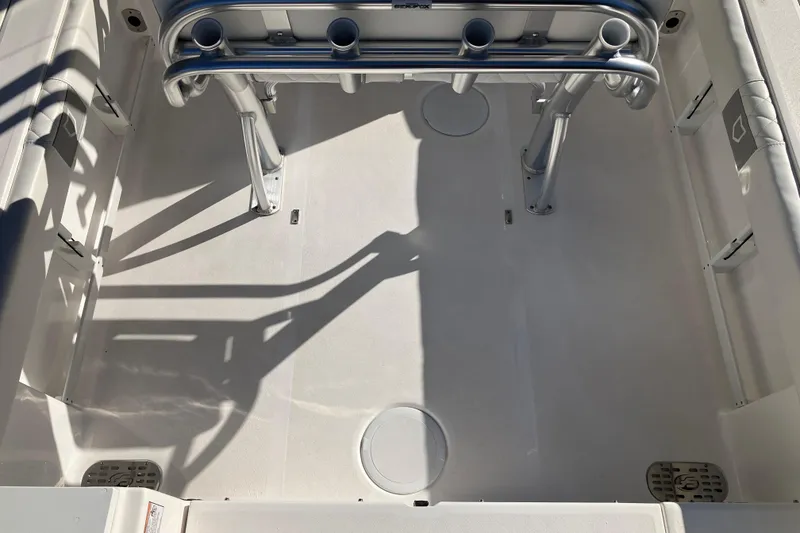 Slide: The Image of 2024 Sea Fox 248 Commander boat deck with rod holders and storage compartments. - 10