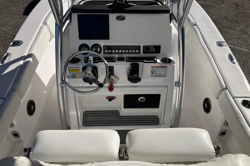 Slide: The Image of 2024 Sea Fox 248 Commander boat console with steering wheel and controls. - 11
