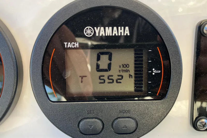 Slide: The Image of Yamaha tachometer display on 2024 Sea Fox 248 Commander boat, showing 552 hours. - 15