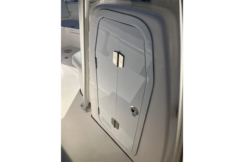 Slide: The Image of 2024 Sea Fox 248 Commander boat storage compartment with sleek design and secure latch. - 18