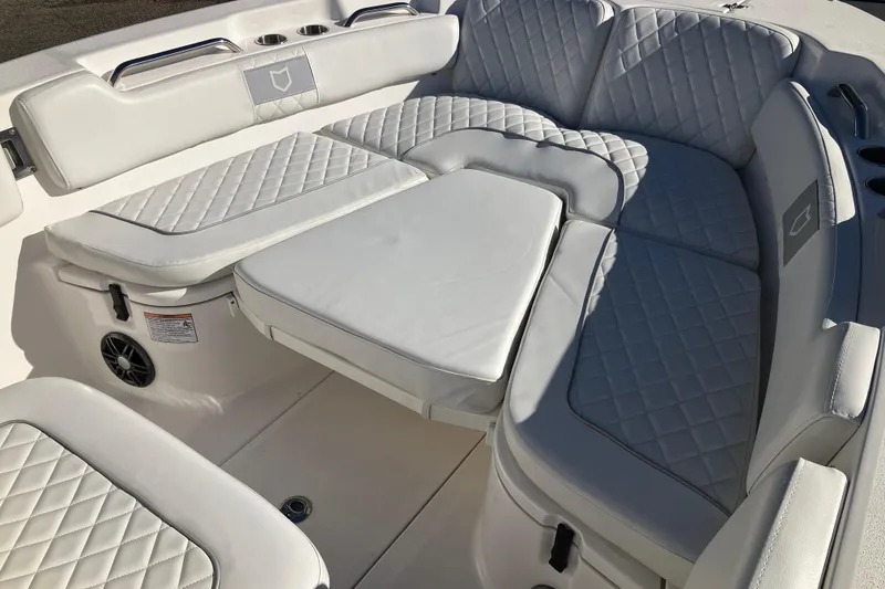Slide: The Image of 2024 Sea Fox 248 Commander boat interior with white quilted seating. - 20