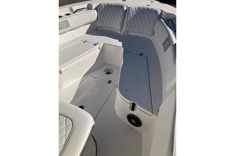 Slide: The Image of 2024 Sea Fox 248 Commander boat interior with cushioned seating and storage compartments. - 21