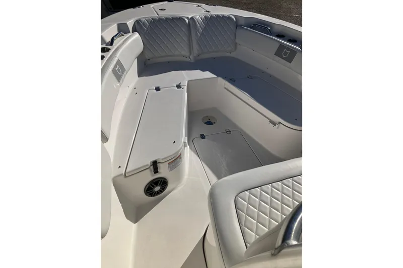 Slide: The Image of 2024 Sea Fox 248 Commander boat interior with cushioned seating and storage compartments. - 22