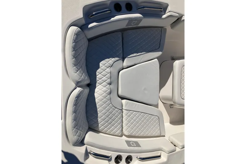 Slide: The Image of 2024 Sea Fox 248 Commander boat interior with quilted seating and cup holders. - 27
